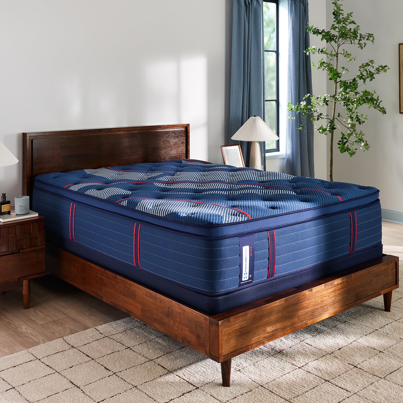 A made bed in a Sleep Center showroom