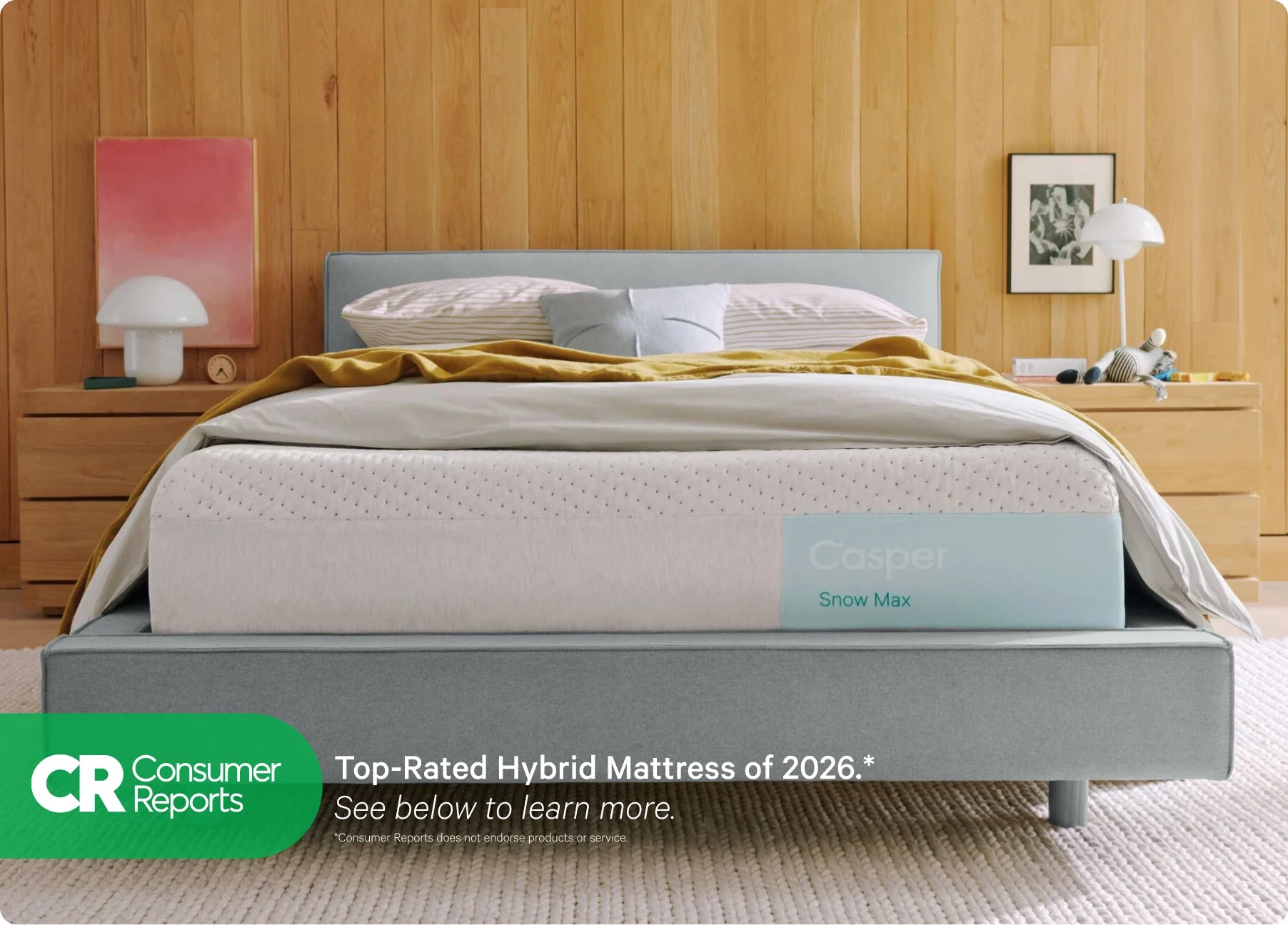 Gray Casper mattress with 'Top Rated Hybrid Mattress of 2025' label from Consumer Reports in a bedroom setting.
