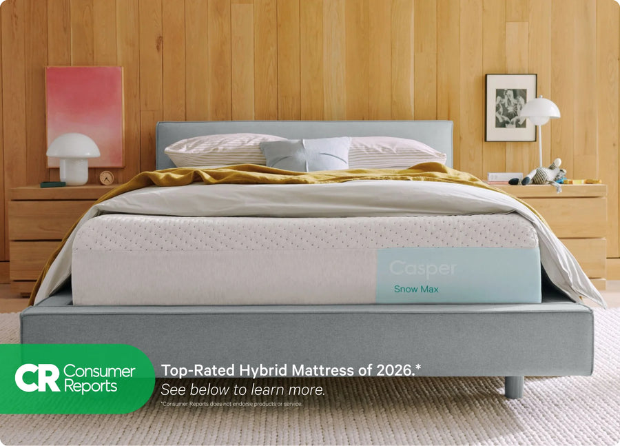 Gray Casper mattress with 'Top Rated Hybrid Mattress of 2025' label from Consumer Reports in a bedroom setting.